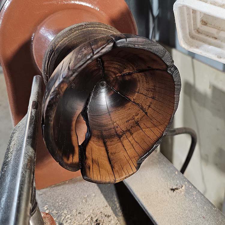 liquid amber burnt wooden bowl on lathe